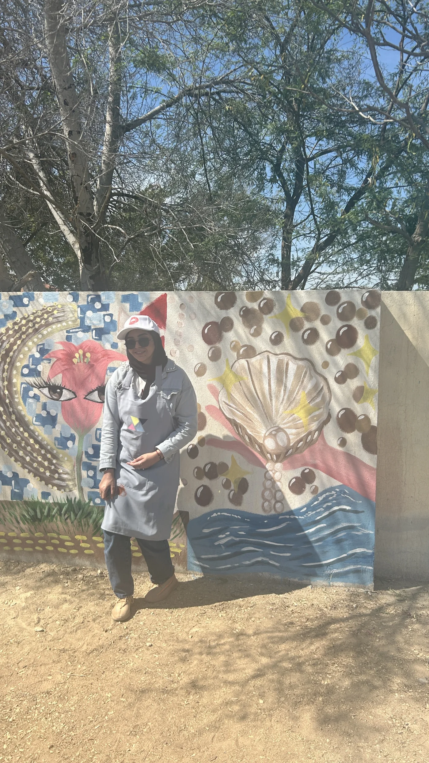 The artist with the completed mural